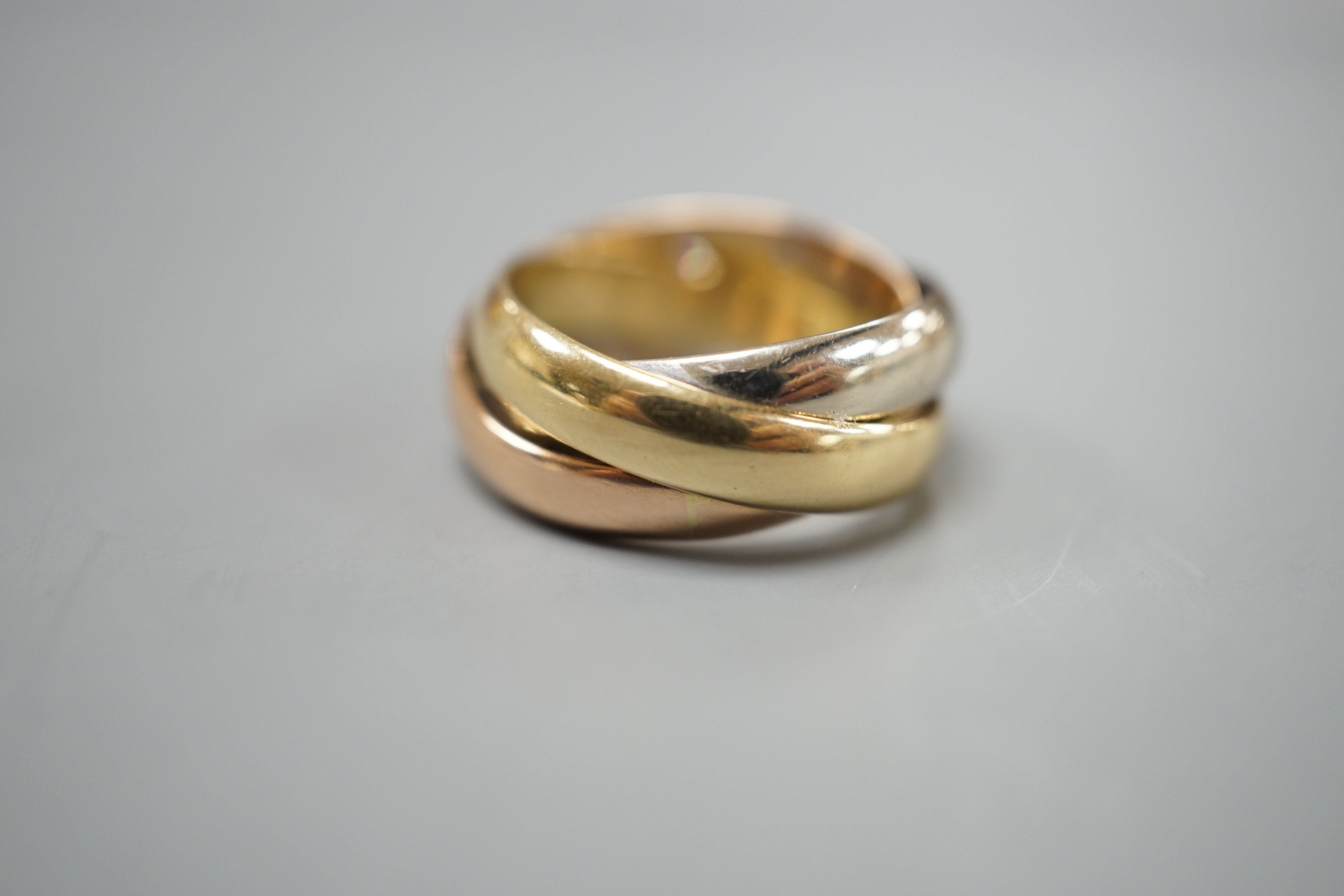A modern Italian 750 and gypsy set diamond Russian triple wedding band, size J/K, gross weight 7.6 grams.